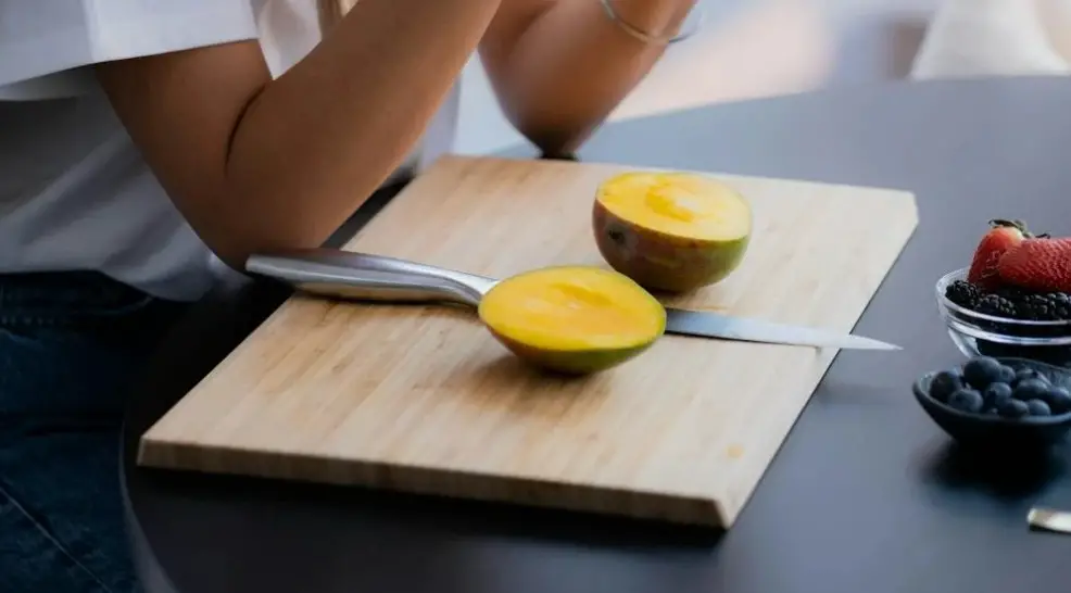 Mango on chopping board